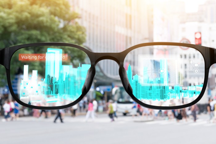 Augmented reality , smart AR glasses technology , smart city , internet of things concept. Customer using AR application see digital 3d rendering building with blur city background.