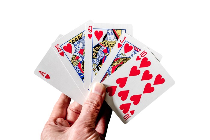 Royal flush poker hand cards isolated on white